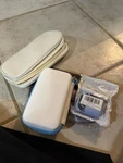 Keep Noble Portable Charger Case Ear Bubs Cars And Cleanerbag, Assorted Colors. Fixed Price $10.00.